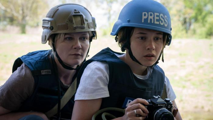 Civil War Movie: Kirsten Dunst and Cailee Spaeny, wearing military helmets