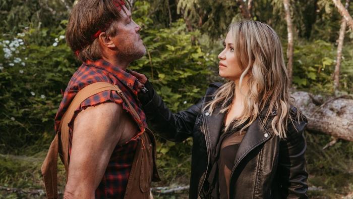 Clear Cut Movie: Jasmine (Chelsey Reist) holds a knife up to the throat of meth cook Bo (Lochlyn Munro)