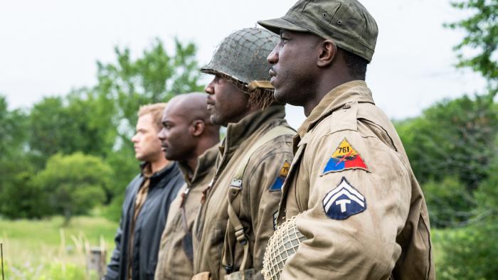 Come Out Fighting Movie: Rich Lowe, Michael Jai White, Hiram A. Murray, and Kellan Lutz stand in a field while wearing Army uniforms