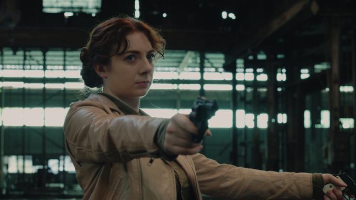 Condor's Nest Movie: Leyna Rahn points two guns at unseen foes