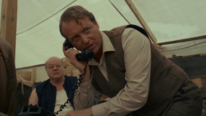 Condor's Nest Movie: Albert Vogel appears to be making a threatening phone call (Michael Ironside watches from the background)