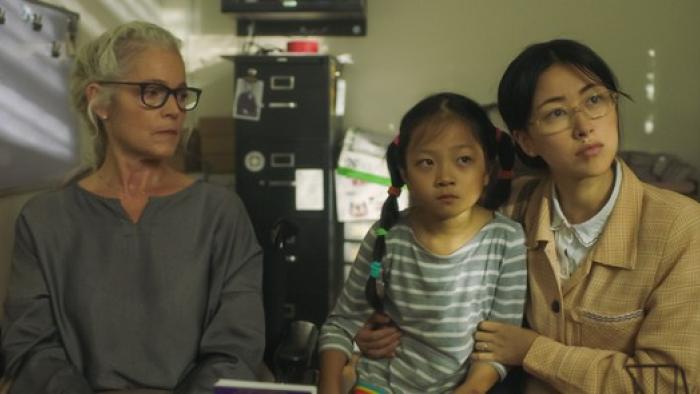 Confetti Movie: Helen, Meimei, and Lan Chen are seated in an office, apparently listening to some serious news