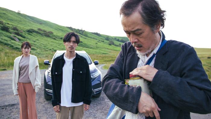 Cottontail: Lily Franky holds a decorative tin to his chest outdoors as Rin Takanashi and Ryo Nishikido look on