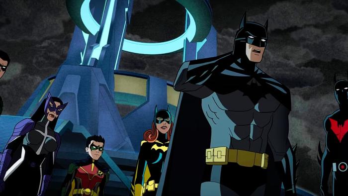 Justice League: Crisis Part 2: Various animated iterations of Batman stand together ready for battle