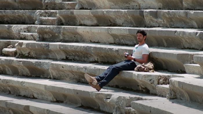 Dil Dhadakne Do: A young Indian man sits on steps.