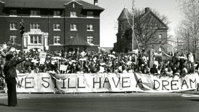 Deaf President Now!: Student protestors hold a banner.