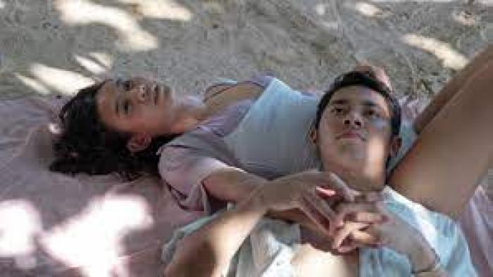 Dear David: two teens lie together in the sun