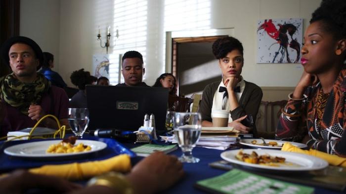 Dear White People movie: A group of students gather around a dining hall table, looking bored