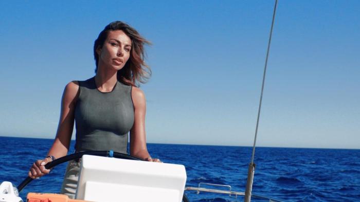 Deep Fear Movie: Naomi (Mãdãlina Ghenea) captains the yacht through the sea
