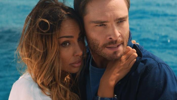 Deep Fear Movie: Naomi (Mãdãlina Ghenea) has her arms wrapped around her fiancé, Jackson (Ed Westwick)
