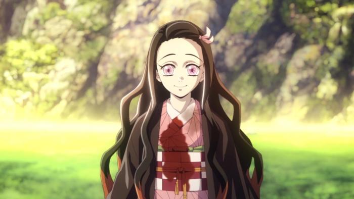 A teenage girl with long dark hair, demonic pink eyes, and a pink bow, gives a warm smile in a sunlit field. 