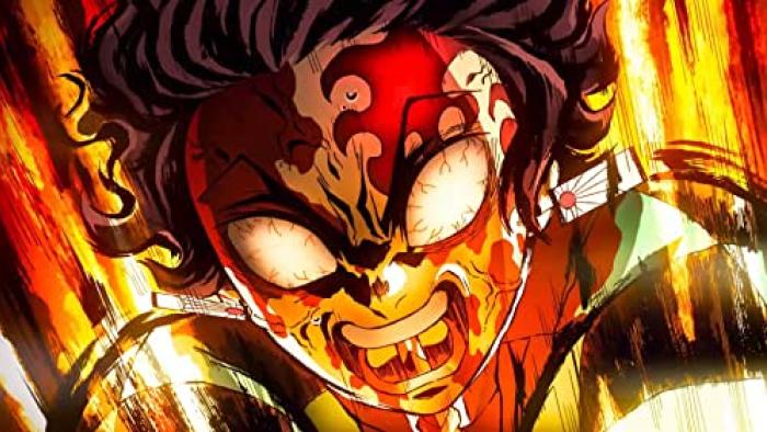 Demon Slayer - To the Swordsmith Village movie: Tanjiro is shown in a fiery rage with gritted teeth and bloodshot eyes, he is surrounded by a fiery background