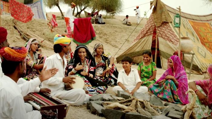 Rainbow: Characters perform Indian folk music in the desert