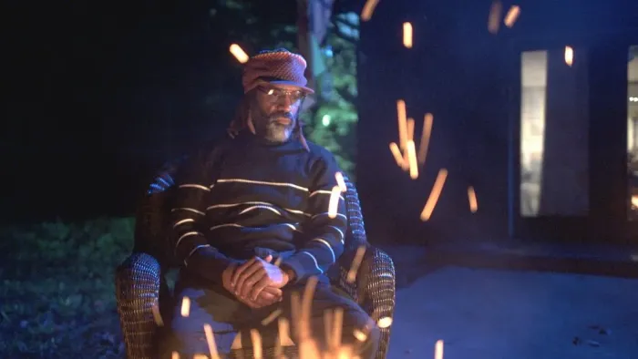 Diddy: The Making of a Bad Boy: Tim Patterson by a fire.