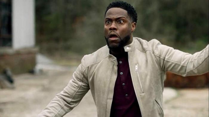 Die Hart 2: Die Harter movie: Kevin Hart in white jacket jumps back surprised while outside