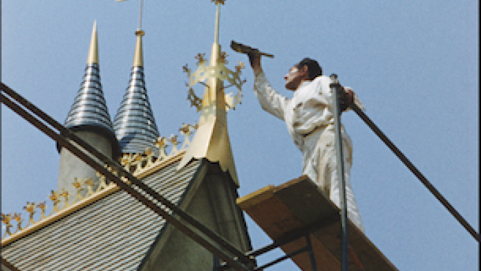 Disneyland Handcrafted: A craftsman puts finishing touches on the castle.