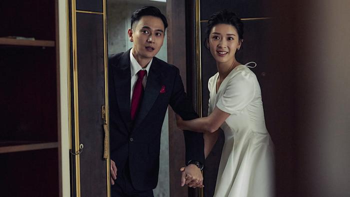 Double Happiness movie: Jennifer Yu pulls Kuan-ting Liu inside the door of his old apartment