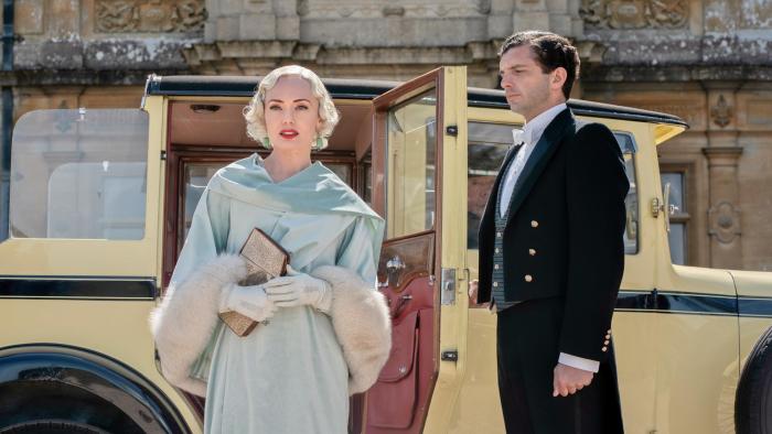 Downton Abbey: A New Era Movie: A woman stepping away from an early automobile
