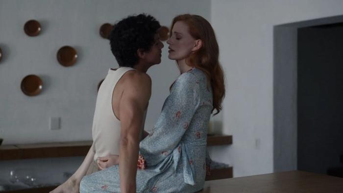 Dreams movie: Isaac Hernandez and Jessica Chastain stand intimately close to each other in a modern, minimalistic room