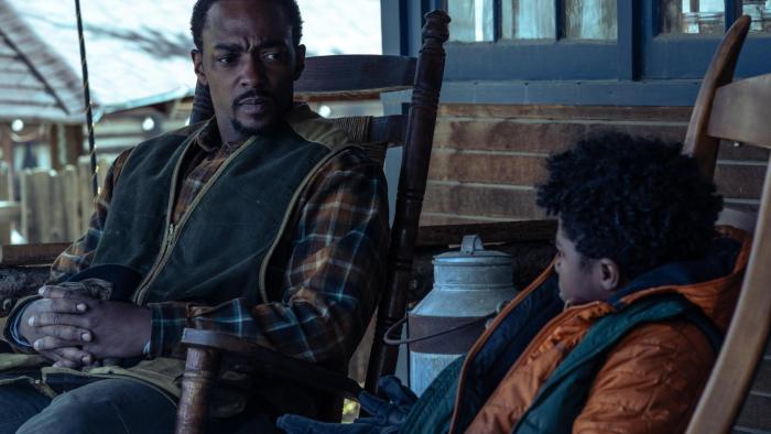 Elevation movie: Anthony Mackie talks with a child in a cabin