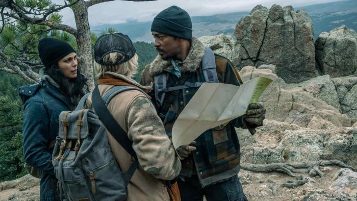 Elevation movie: Morena Baccarin, Maddie Hasson, and Anthony Mackie look at a map in the woods