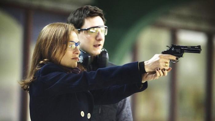 Elle Movie: Michele shoots a gun with Patrick