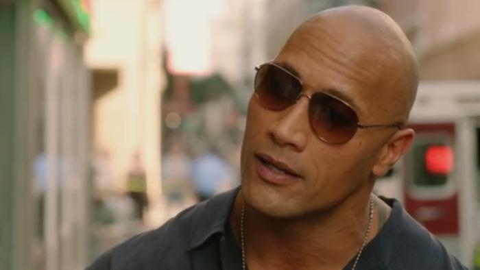 Empire State: Dwayne Johnson wearing sunglasses talking by ambulance