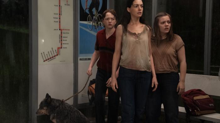 The End of Oak Street Movie: Denise guards her two kids as they carefully make their way through a house