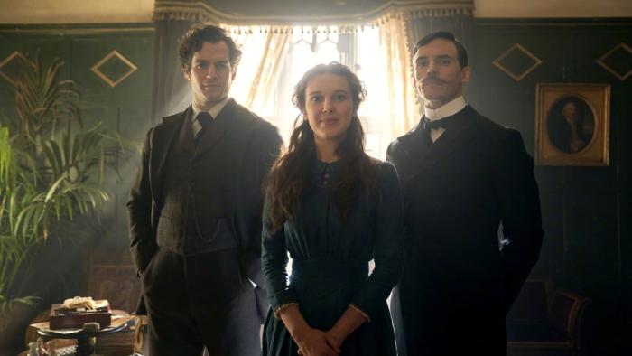 Enola Holmes movie: Enola and brothers Mycroft and Sherlock pose indoors