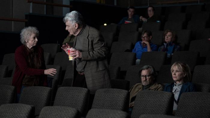 Ex-Husbands movie: Richard Benjamin makes room for his wife in a movie theater, with Griffin Dunne and Rosanna Arquette seated nearby