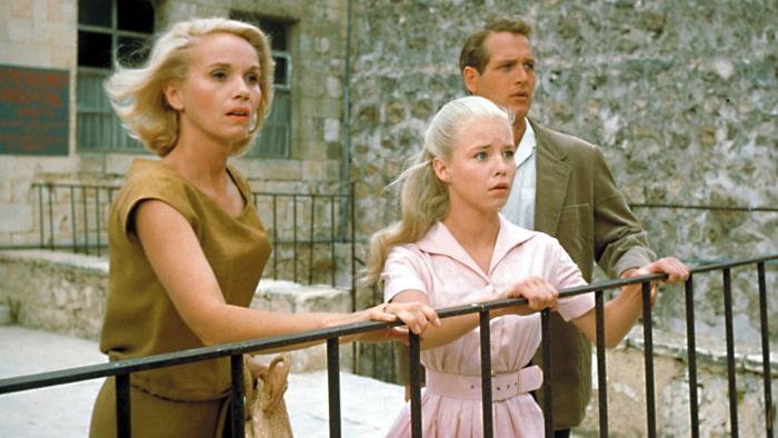 Exodus: Paul Newman, a blond woman, and a blond girl by a railing