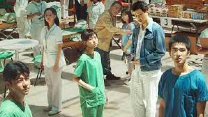 Eye of the Storm: doctors and people stand around