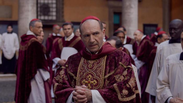 Conclave: Ralph Fiennes as Cardinal Lawrence with other members of the clergy behind him.