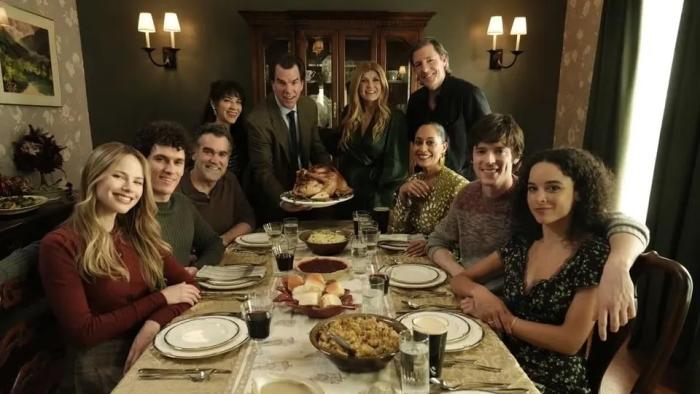 The Family McMullen movie: Ten adults, including Edward Burns and Connie Britton, sit at a dining table for a family holiday meal