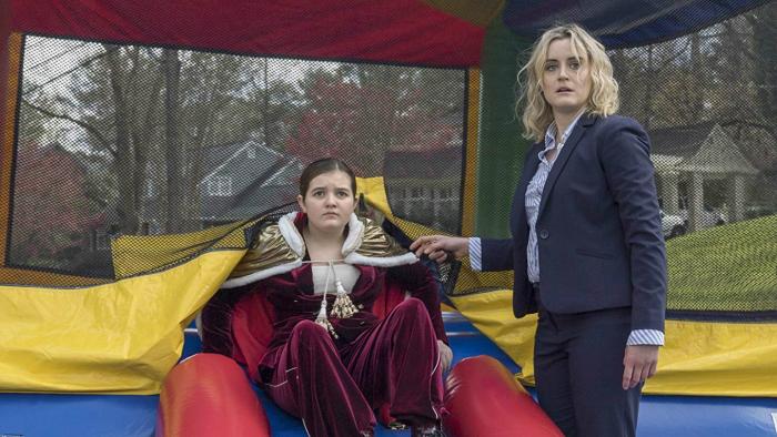 Family Movie: Maddie emerges from a bounce house as Kate waits 