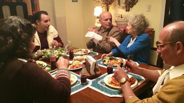 Feast of the Seven Fishes Movie: The family sits together at dinner