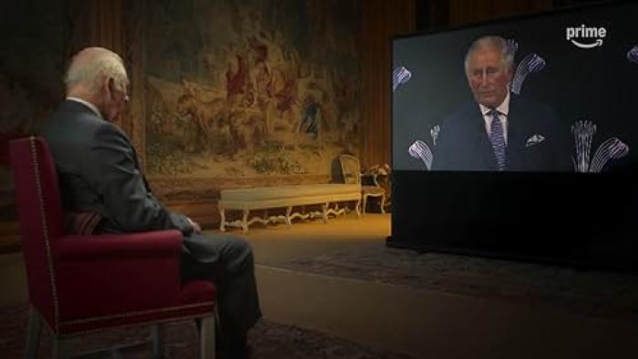 Finding Harmony—A King's Vision: King Charles III sits in a chair watching himself on a large TV screen