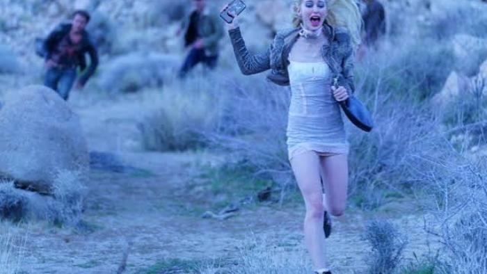 Find Your Friends: Woman running in fear in a rocky, desert landscape.