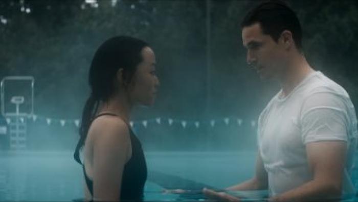 Float Movie: Andrea Bang stares at Robbie Ammell next to a pool