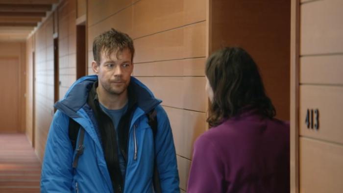 Force Majeure: Johannes Kuhnke and Lisa Loven Kongsli stand in a hallway with wood-panelled walls