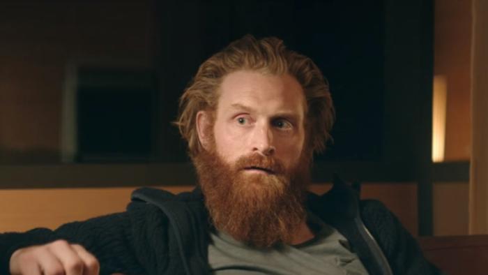 Force Majeure: Kristofer Hivju sits on a sofa and listens while looking concerned