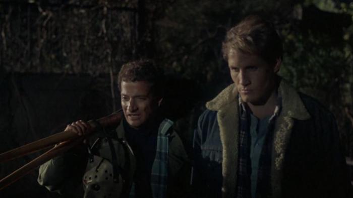 Friday the 13th Part VI -- Jason Lives: Ron Palillo and Thom Mathews stand in the darkness, with Ron holding two shovels over his shoulder