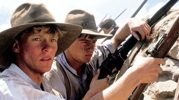 Gallipoli movie: Mark Lee stands in a trench at Gallipoli with his fellow soldiers, armed with a rifle
