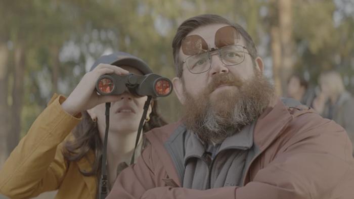 Get Away: Aisling Bea looks through a pair of binoculars, as Nick Frost stands beside her looking in the same direction