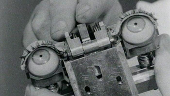 Ghost in the Machine movie: a close up black and white photo of artificial intelligence machine with eyes