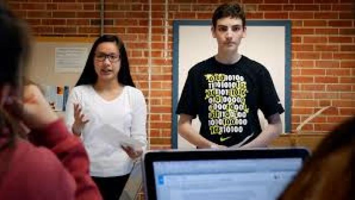 Girl Talk Movie: Two students stand behind a podium