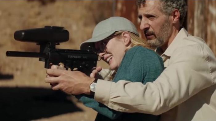 Gloria Bell Movie: Arnold teaches Gloria how to shoot a paintball gun