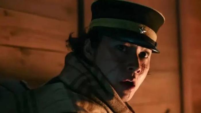 Golden Kamuy: Soldier in uniform and hat, looking surprised in dim lighting.