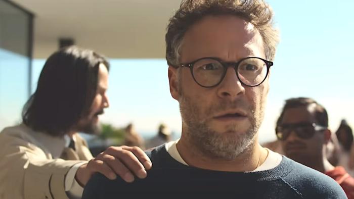 Good Fortune movie: Keanu Reeves puts his hand on Seth Rogen's shoulder, with Aziz Ansari looking on