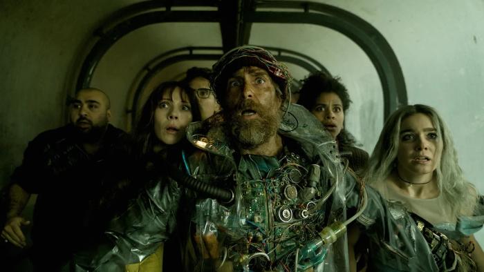 Good Luck, Have, Fun, Don't Die movie: Sam Rockwell looks frightened while holding back a group of people
